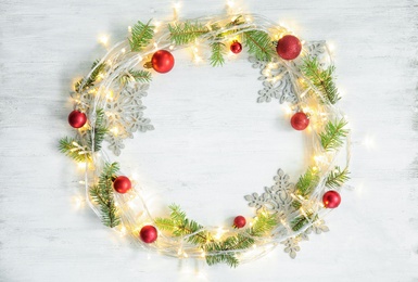 Flat lay composition with Christmas decoration on wooden background