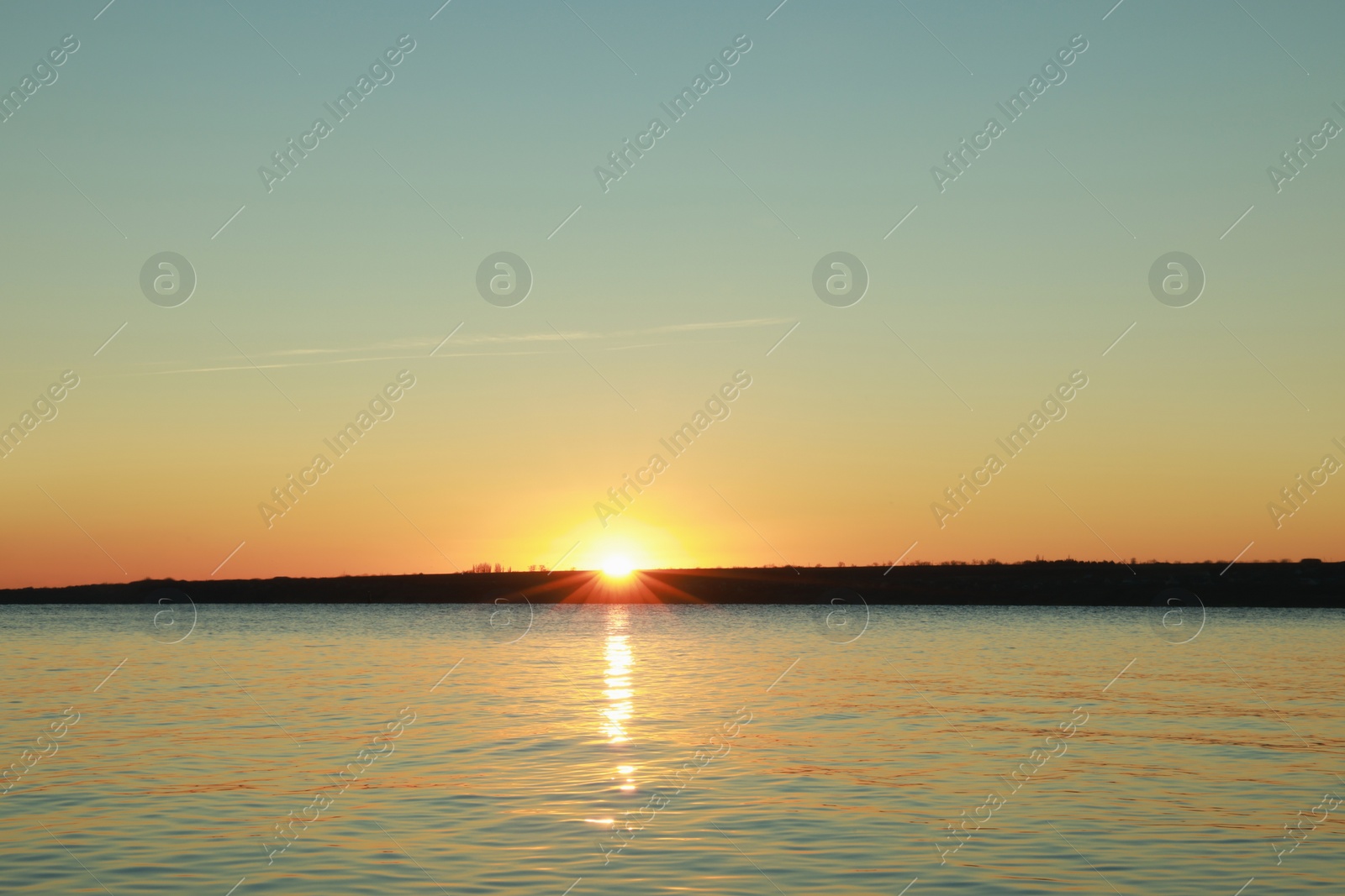 Photo of Picturesque view of beautiful sunset over calm river