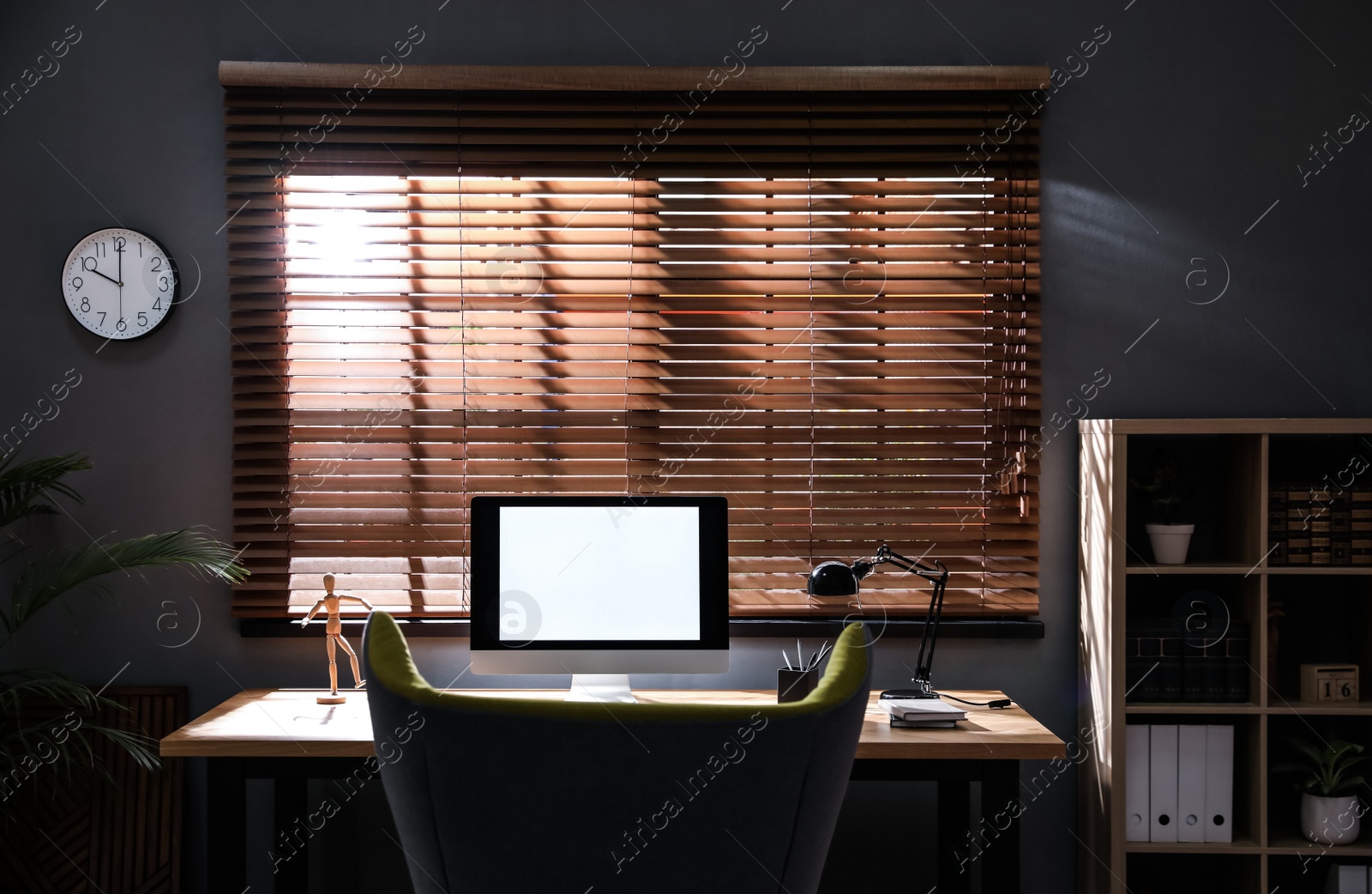 Photo of Stylish room interior with modern computer and comfortable office chair