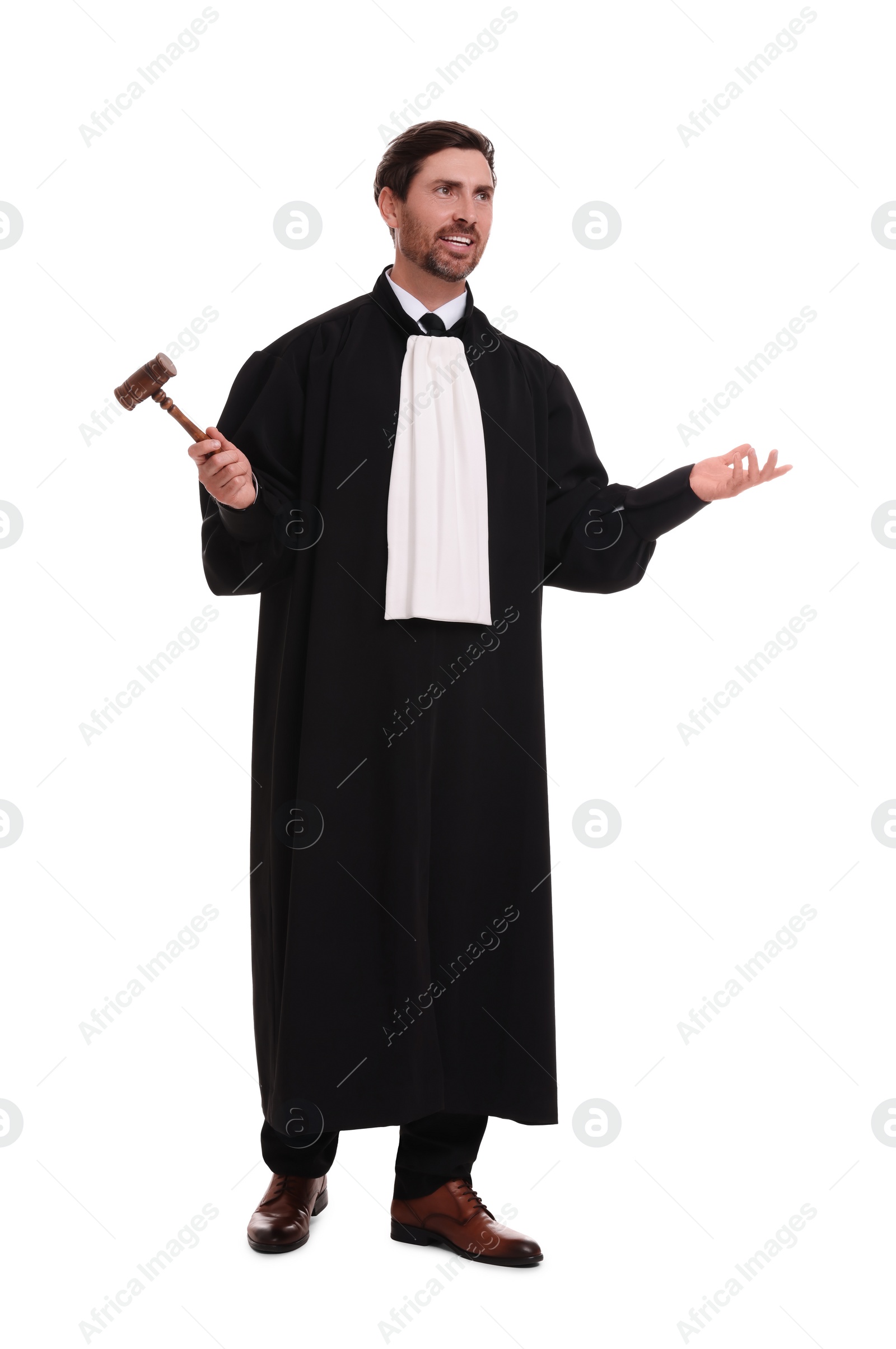 Photo of Smiling judge with gavel on white background