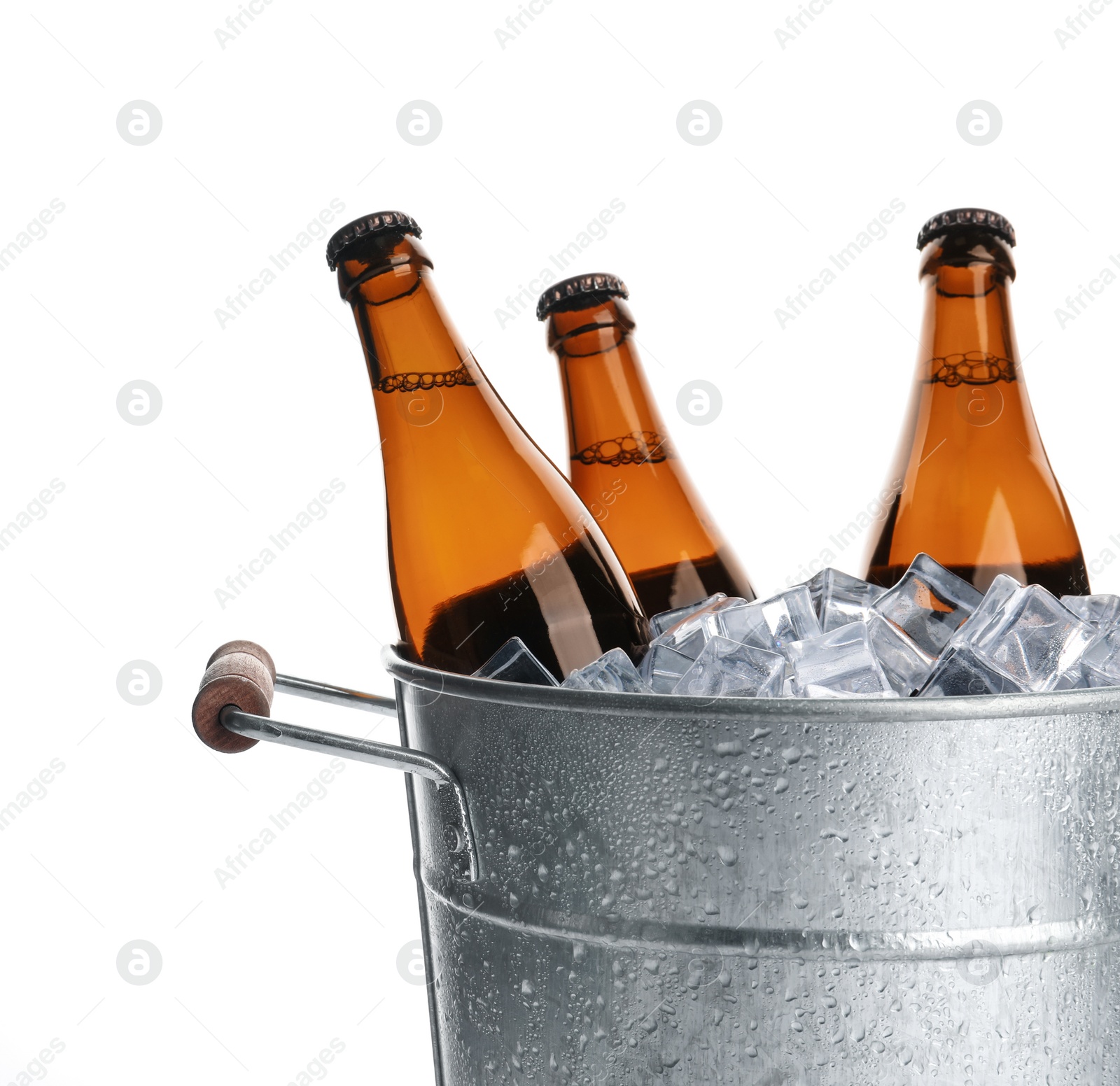 Photo of Metal bucket with bottles of beer and ice cubes isolated on white