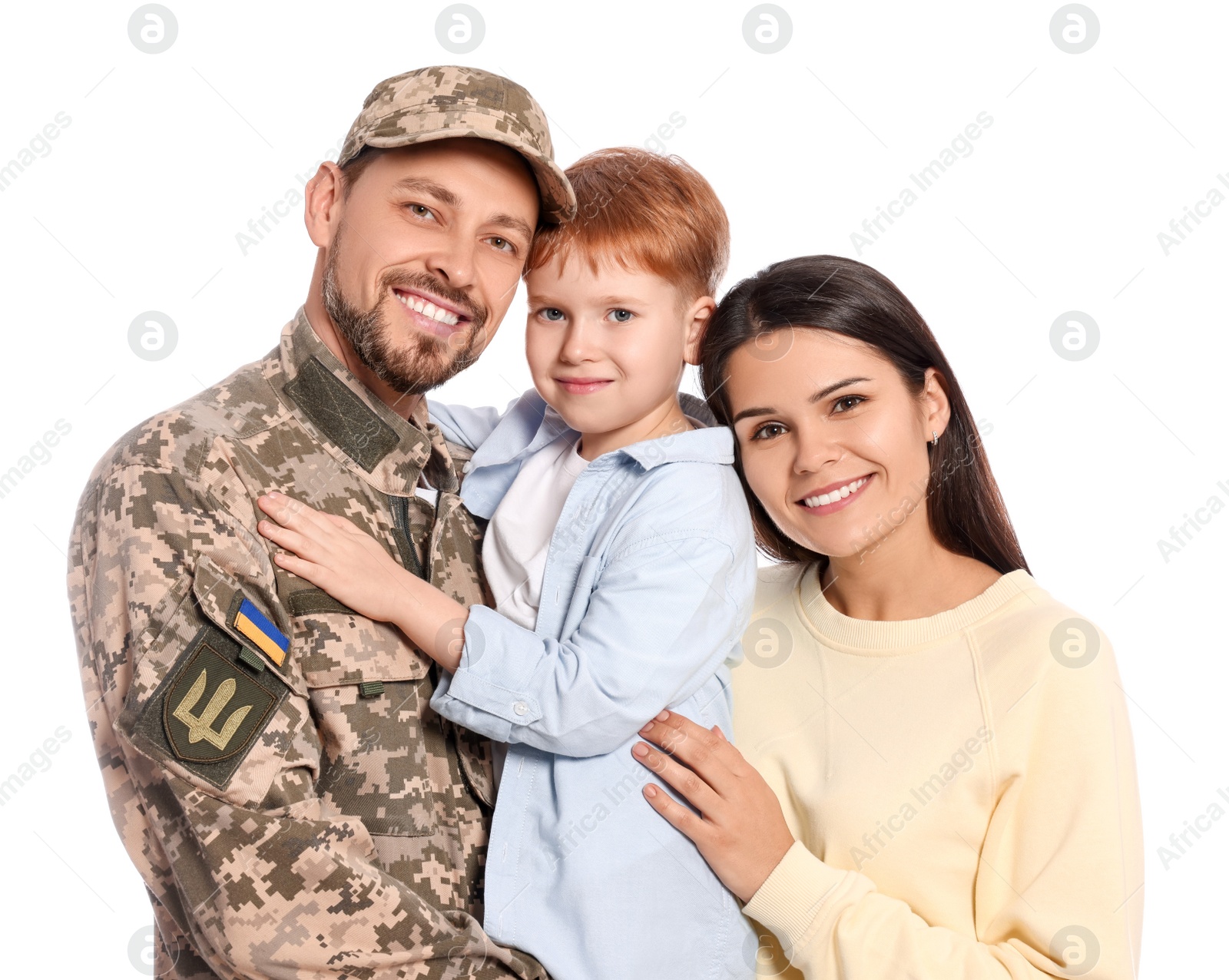 Photo of Ukrainian defender in military uniform and his family on white background