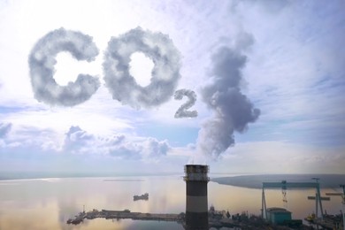 Image of Inscription CO2 made of smoke. Aerial view of industrial factory