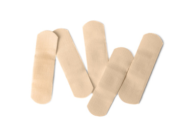 Photo of Medical sticking plasters isolated on white. First aid item