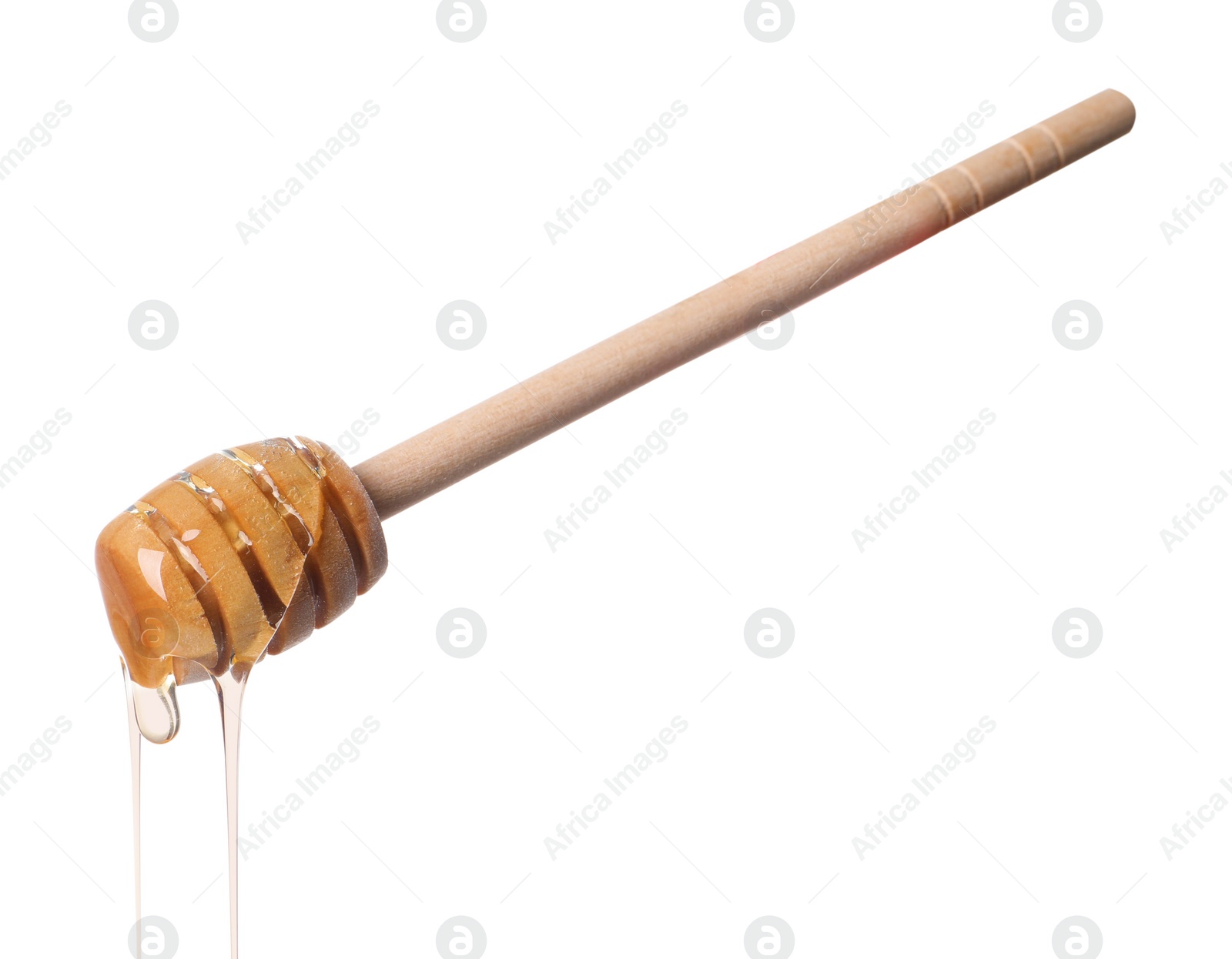 Photo of Natural honey dripping from dipper on white background