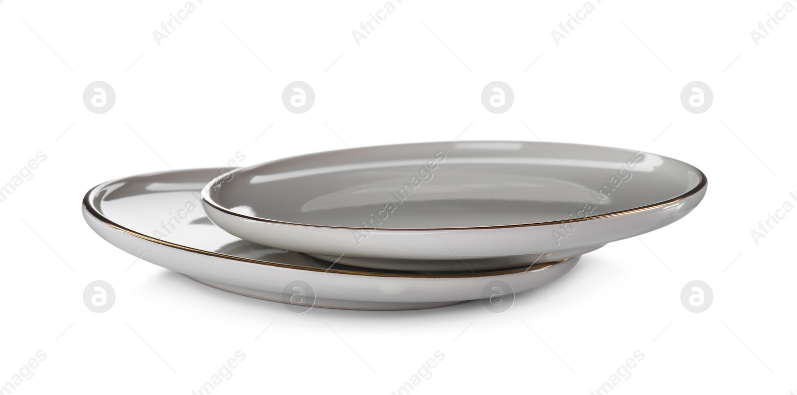 Photo of Clean empty ceramic plates on white background