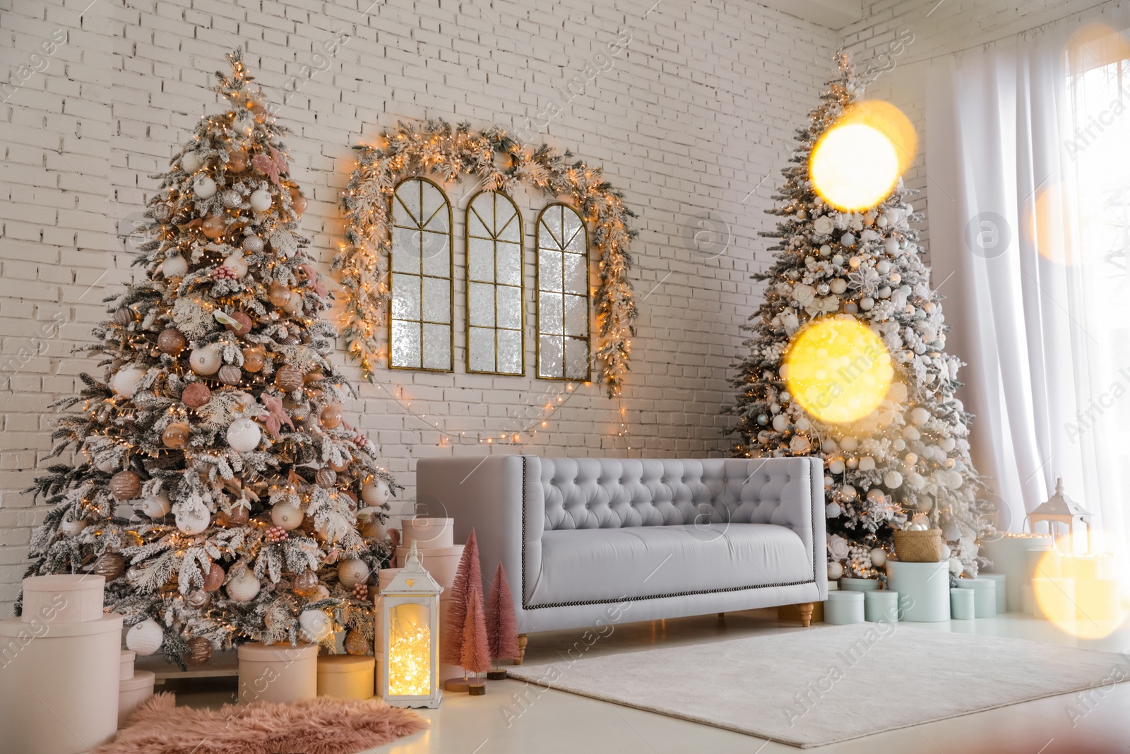 Photo of Beautiful interior of living room with decorated Christmas trees