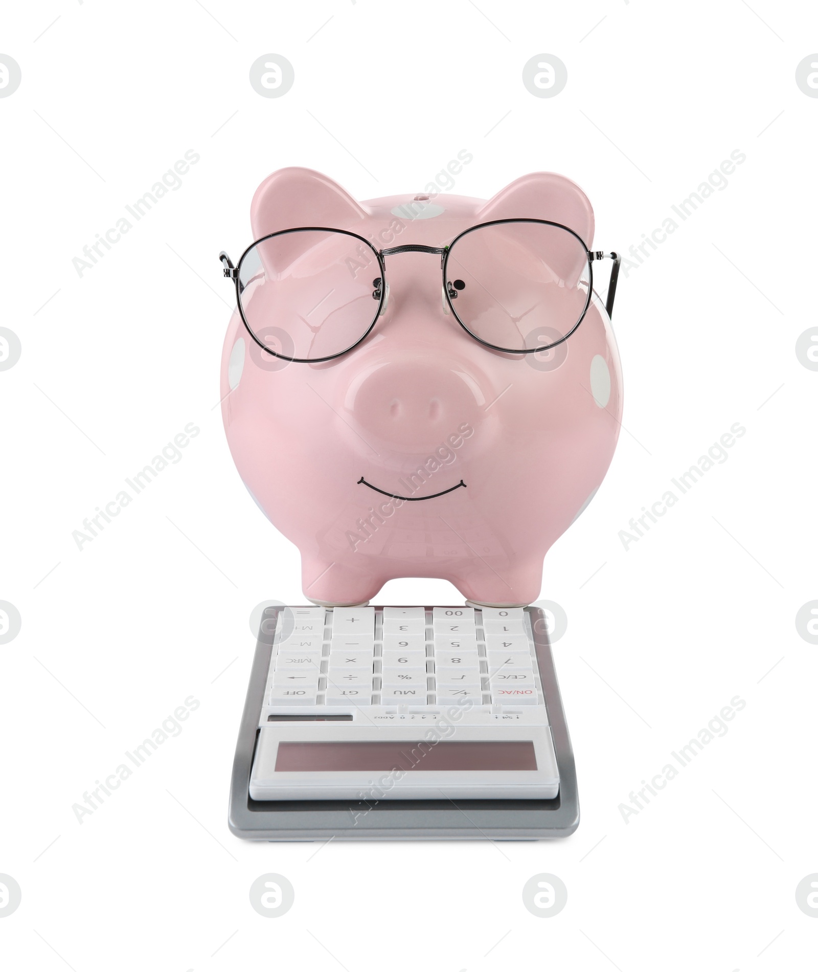 Photo of Calculator and pink piggy bank in glasses isolated on white