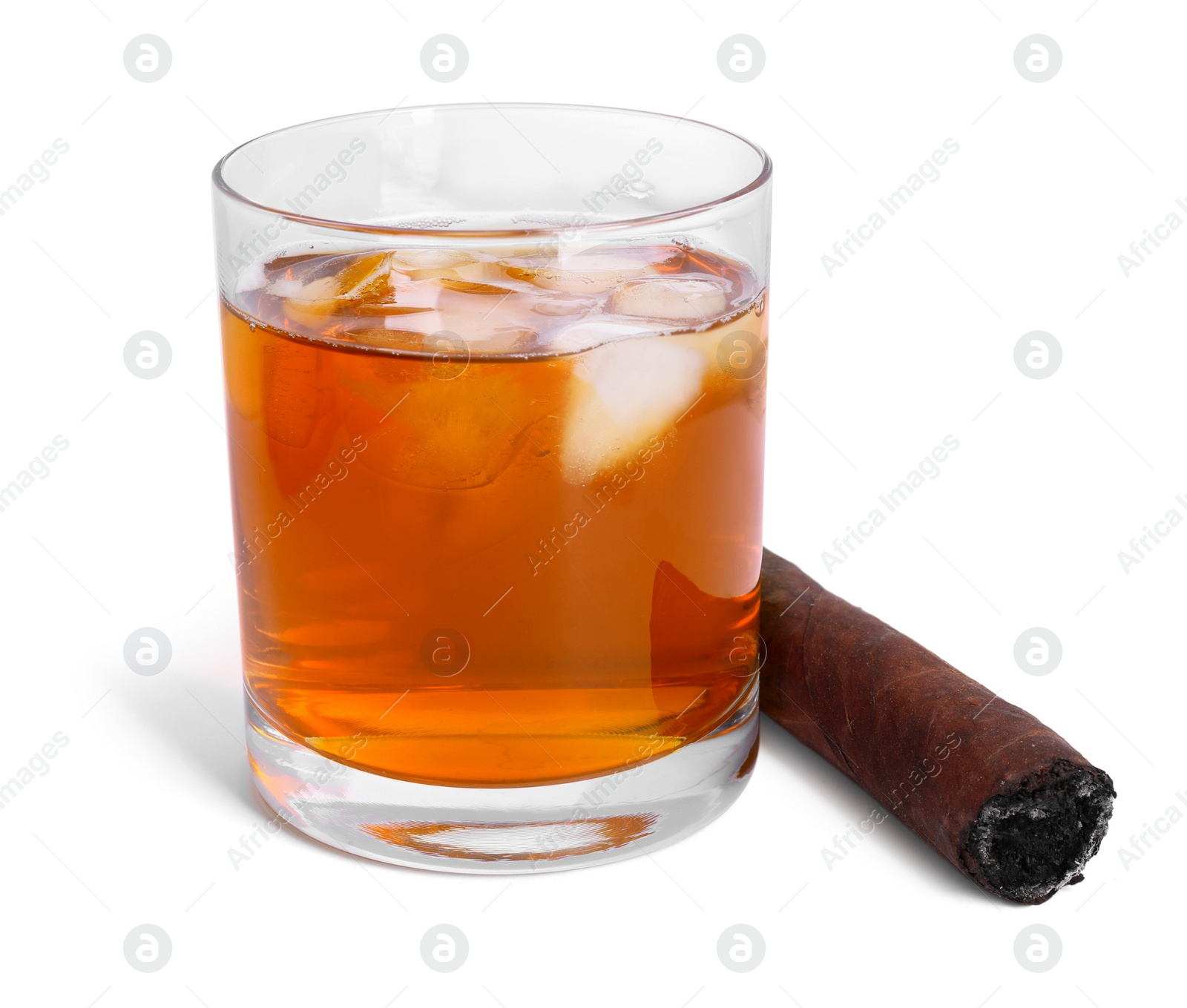 Photo of Glass of whiskey and burnt cigar isolated on white