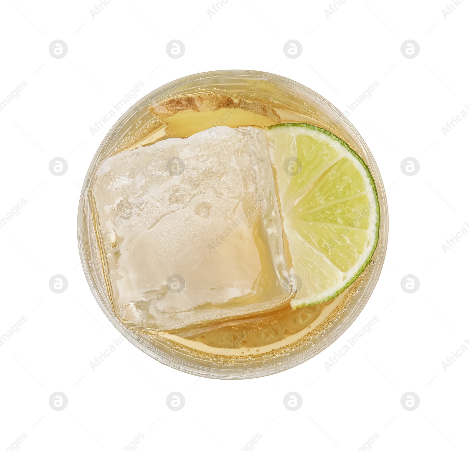 Photo of Glass of tasty ginger ale with ice cube and lime slice isolated on white, top view