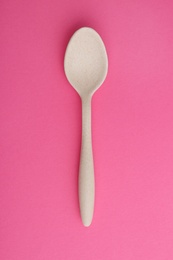 Photo of Clean spoon on color background, top view