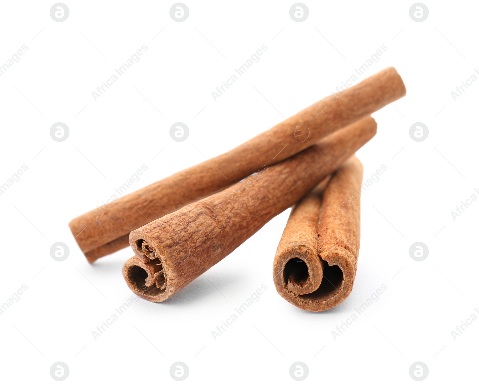 Photo of Aromatic cinnamon sticks on white background