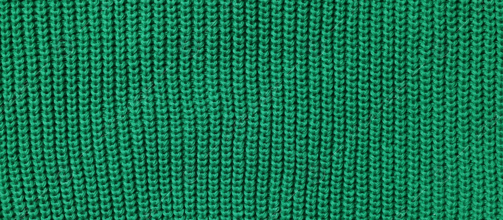 Photo of Texture of soft green fabric as background, top view