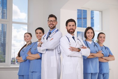 Photo of Teamprofessional doctors in clinic hallway
