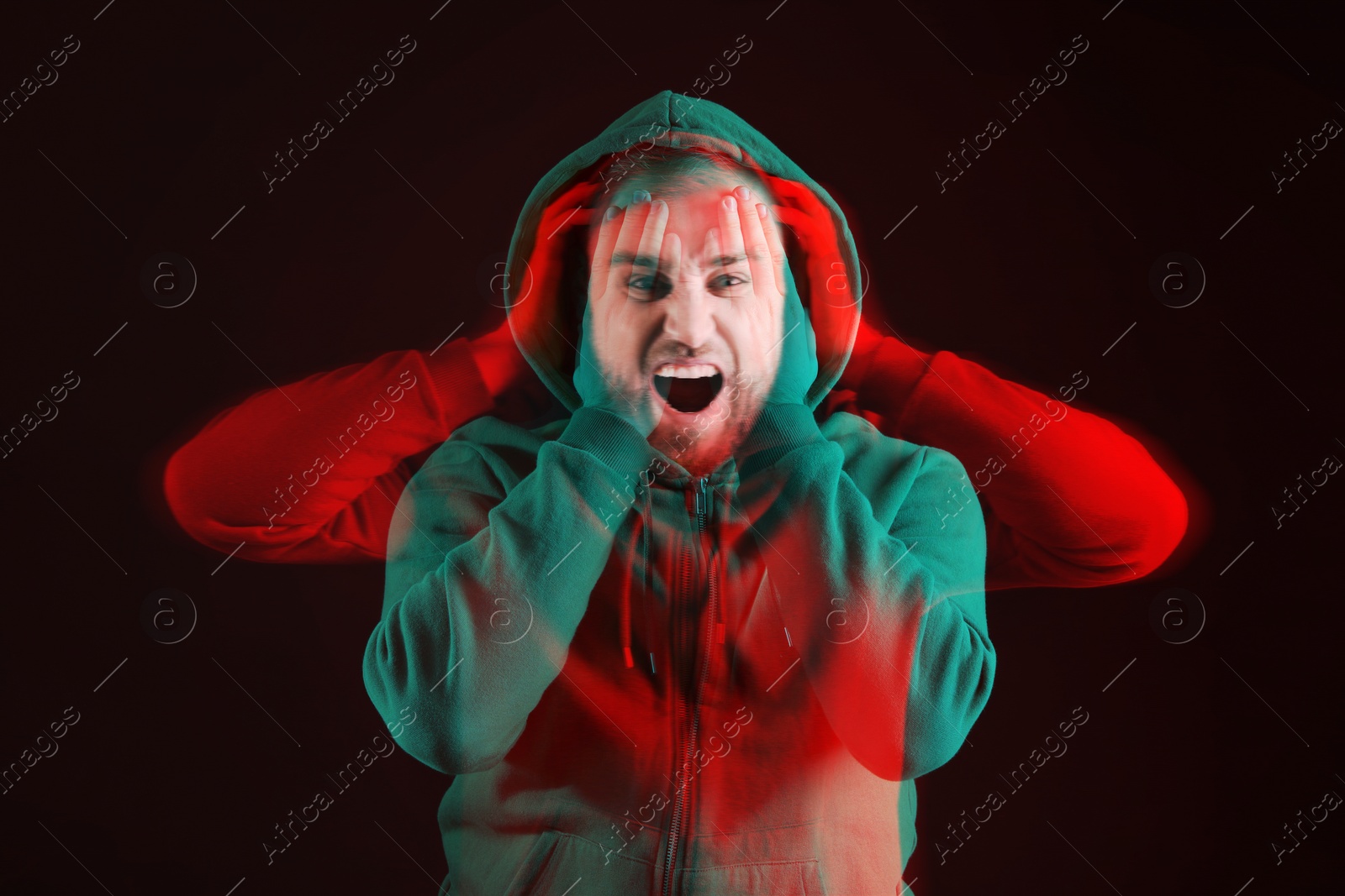 Image of Man suffering from paranoia on black background. Double exposure with photos showing emotional instability