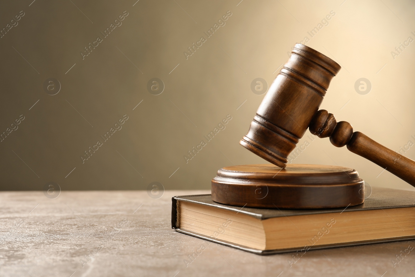 Photo of Wooden gavel and book on table. Law concept