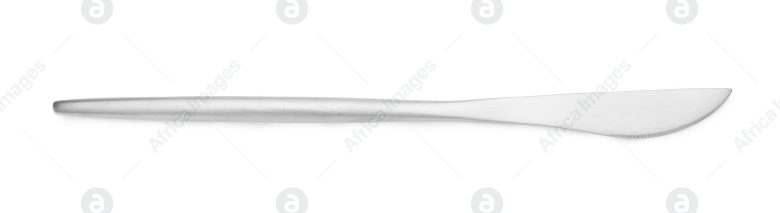 Photo of One shiny silver knife isolated on white, top view