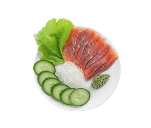 Sashimi set (salmon slices) with cucumber, greens, vasabi and funchosa isolated on white, top view