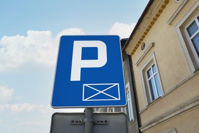 Traffic sign Parking Space on city street, low angle view