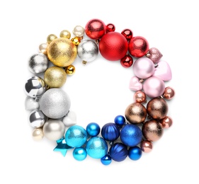 Beautiful Christmas wreath made of colorful baubles on white background, top view