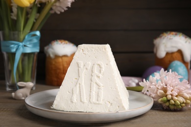 Traditional cottage cheese Easter paskha on wooden table