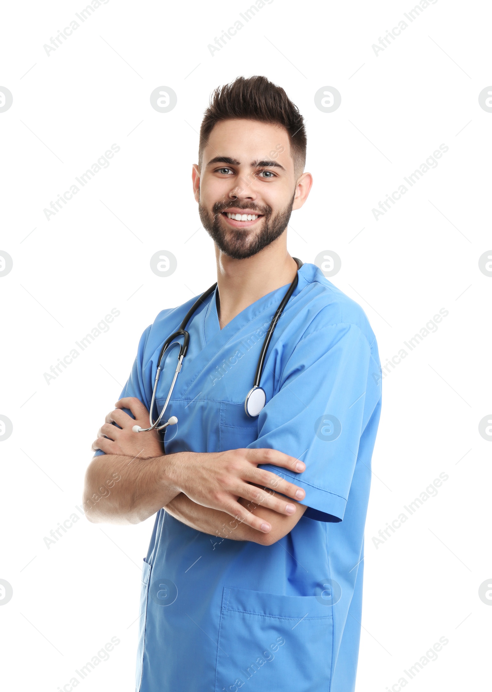 Photo of Young male doctor in uniform isolated on white