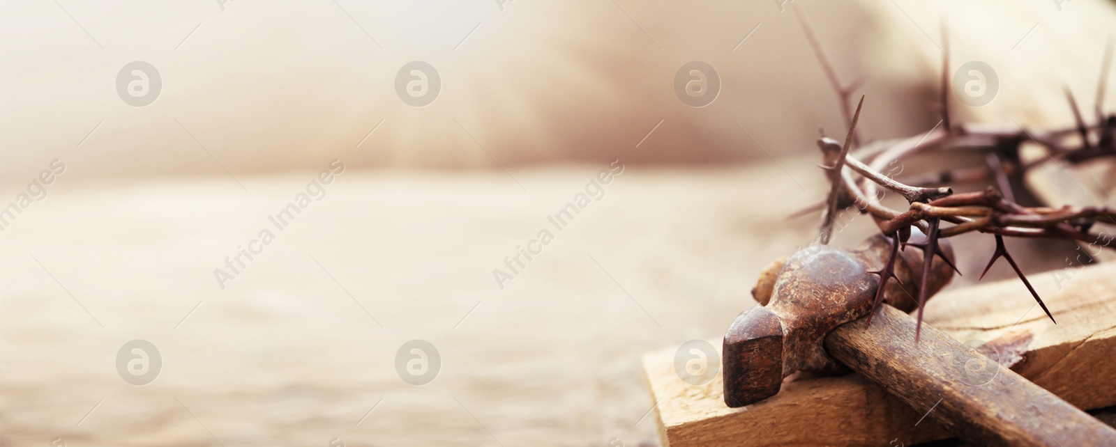 Image of Passion Of Jesus Christ. Crown of thorns, wooden plank and hammer on grey background, banner design 