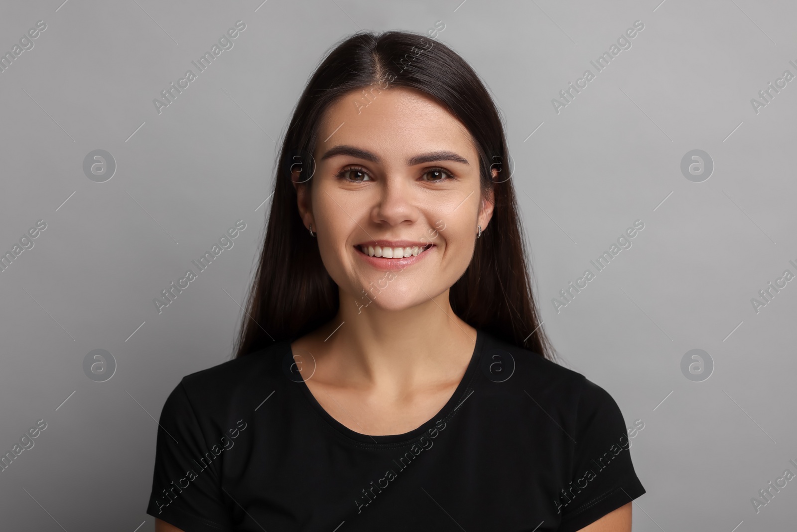 Photo of Personality concept. Happy woman on grey background