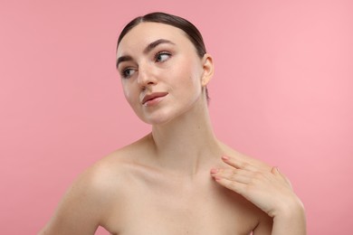 Photo of Portrait of beautiful woman on pink background