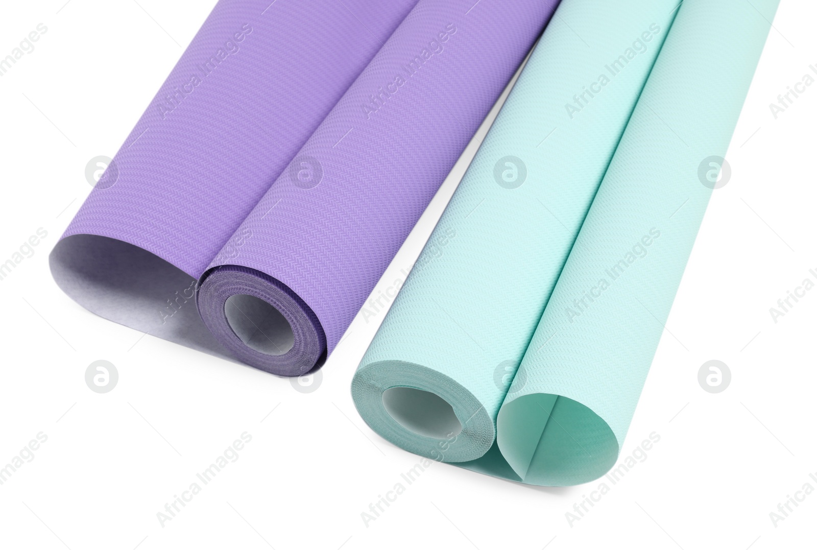 Photo of Two colorful wallpaper rolls isolated on white