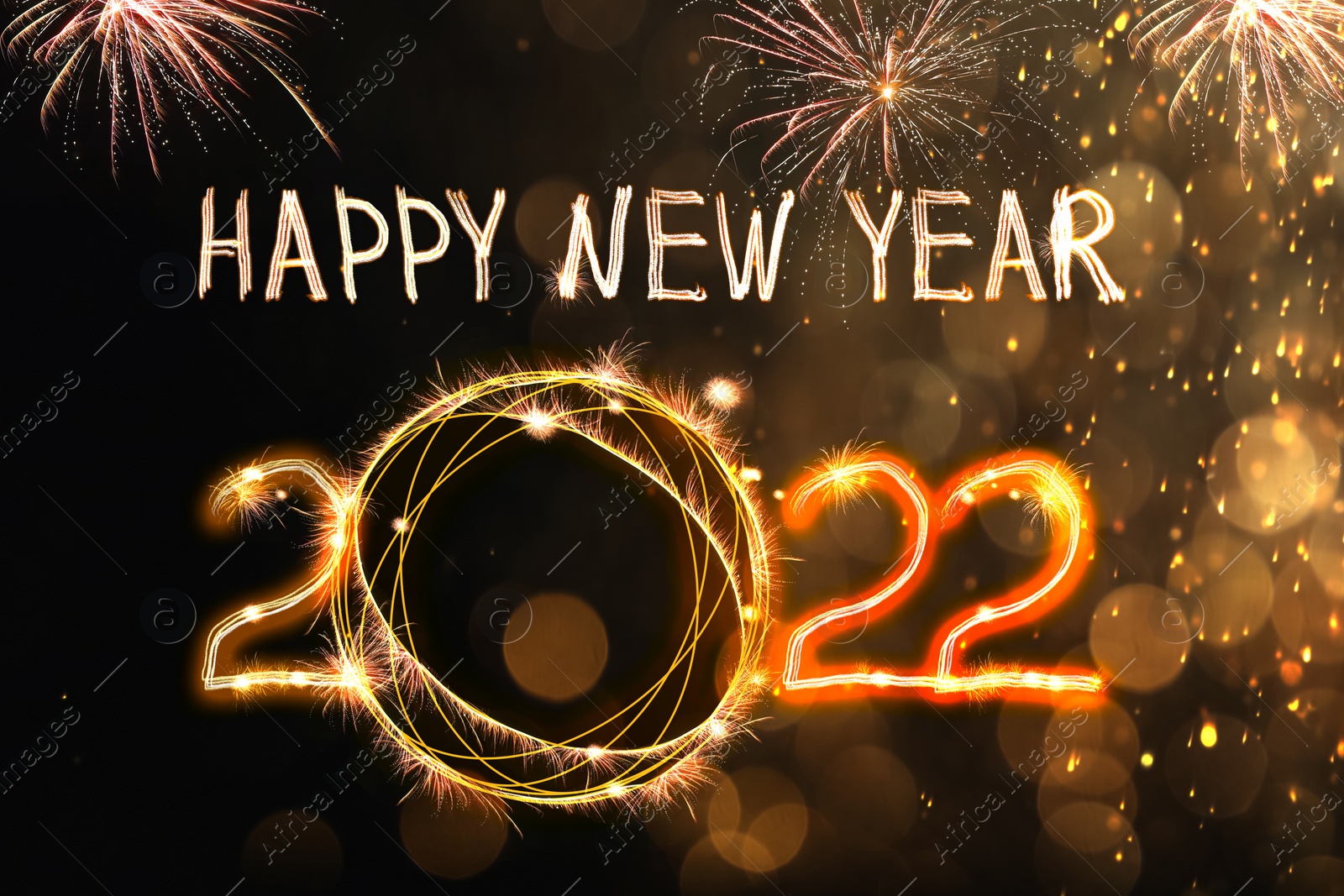 Image of Bright text Happy New 2022 Year made of firework on dark background. Greeting card design