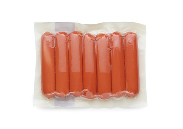 Photo of Vacuum pack with sausages isolated on white, top view. Meat product