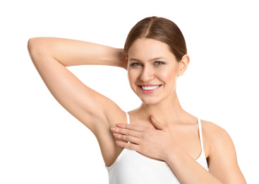 Young beautiful woman showing armpit with smooth clean skin on white background