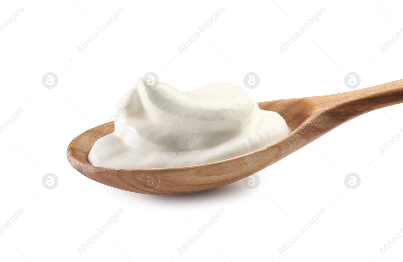 Photo of Sour cream in wooden spoon isolated on white