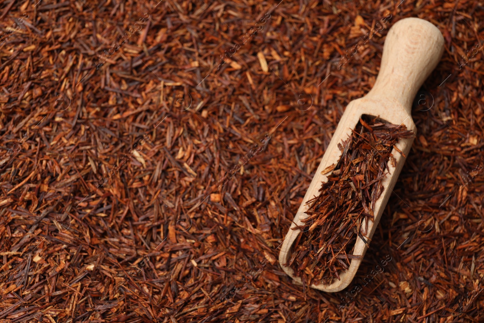 Photo of Rooibos tea and wooden scoop, top view