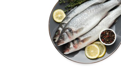 Photo of Plate with fresh sea bass fish, lemon and pepper on white background, top view