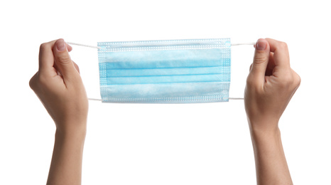 Photo of Woman holding disposable face mask on white background, closeup. Protective measures during coronavirus quarantine