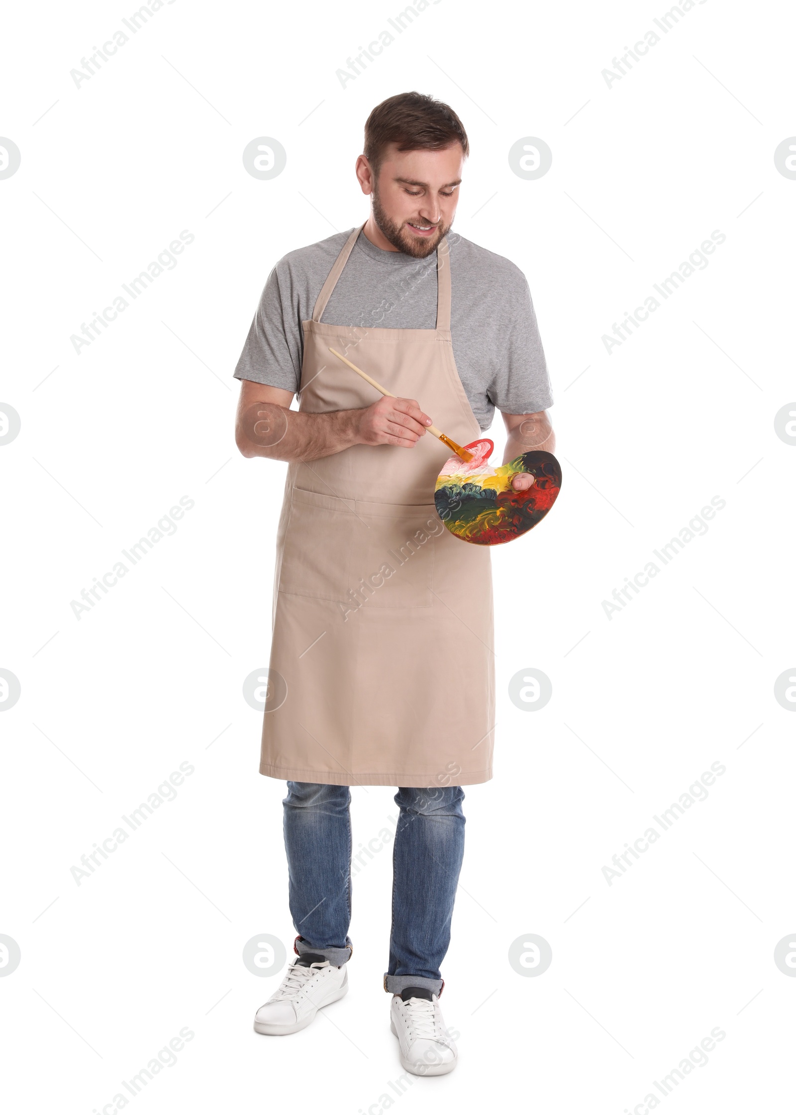 Photo of Man with painting tools on white background. Young artist