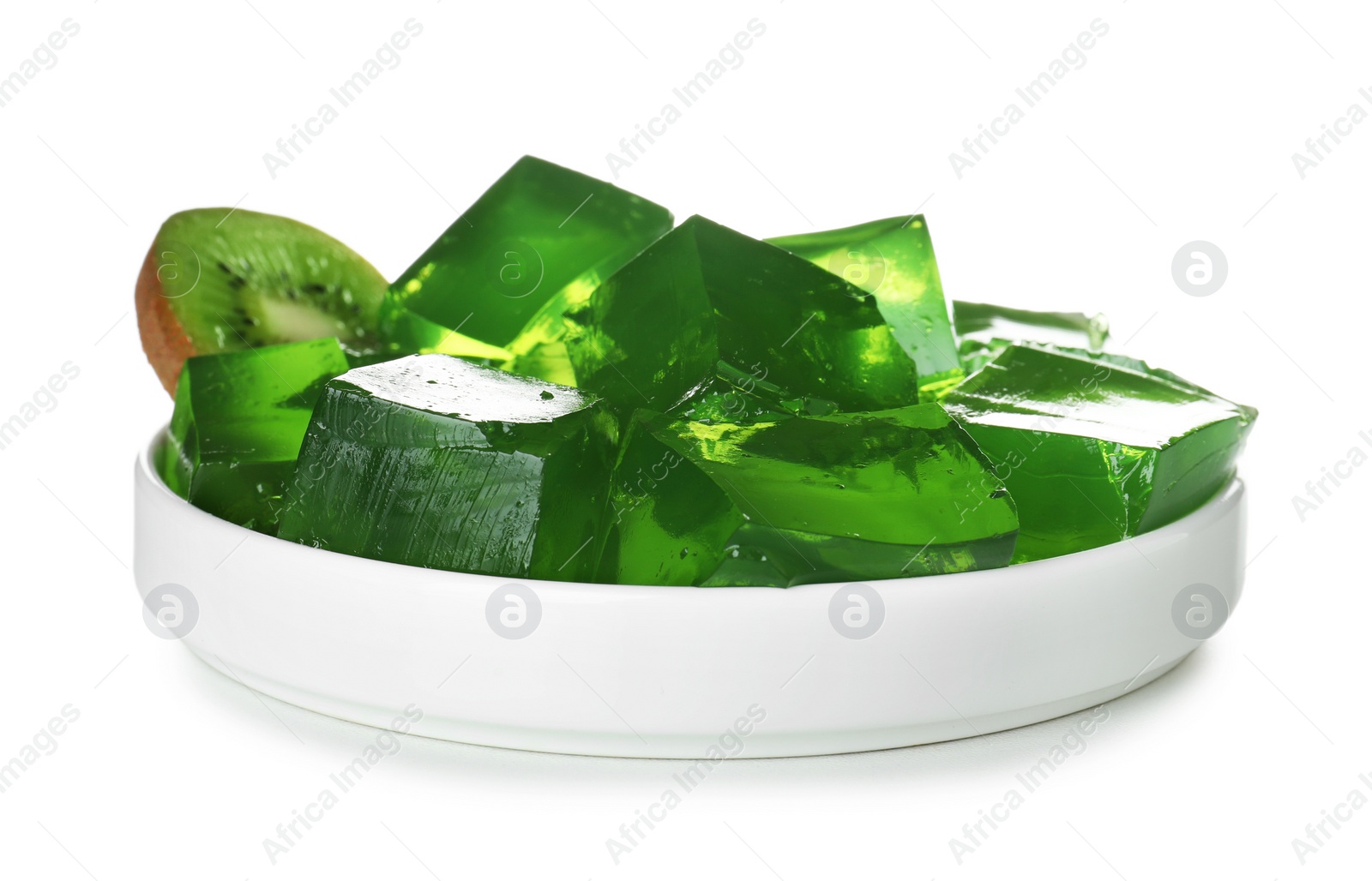 Photo of Plate with green jelly cubes and kiwi on white background