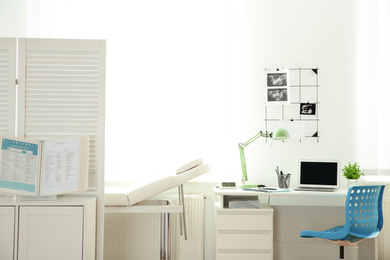 Photo of Interior of modern medical office. Doctor's workplace