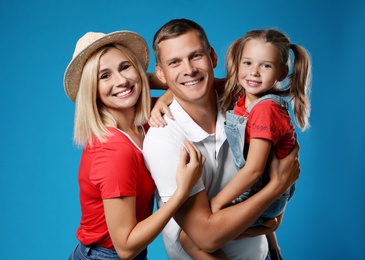 Photo of Happy family with child on blue background
