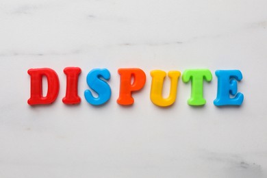 Word Dispute made of colorful letters on white marble table, flat lay