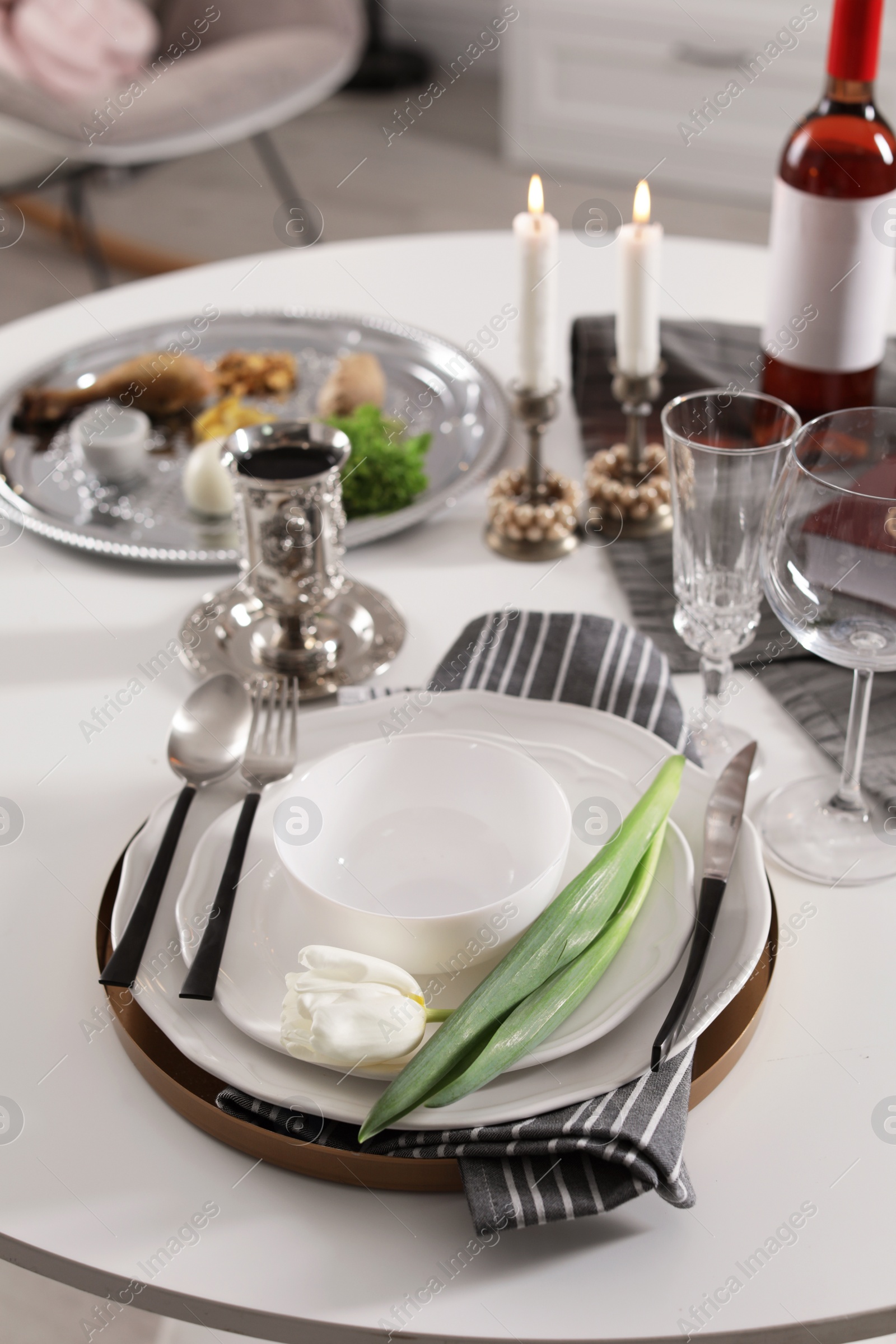 Photo of Festive Passover table setting at home. Pesach celebration