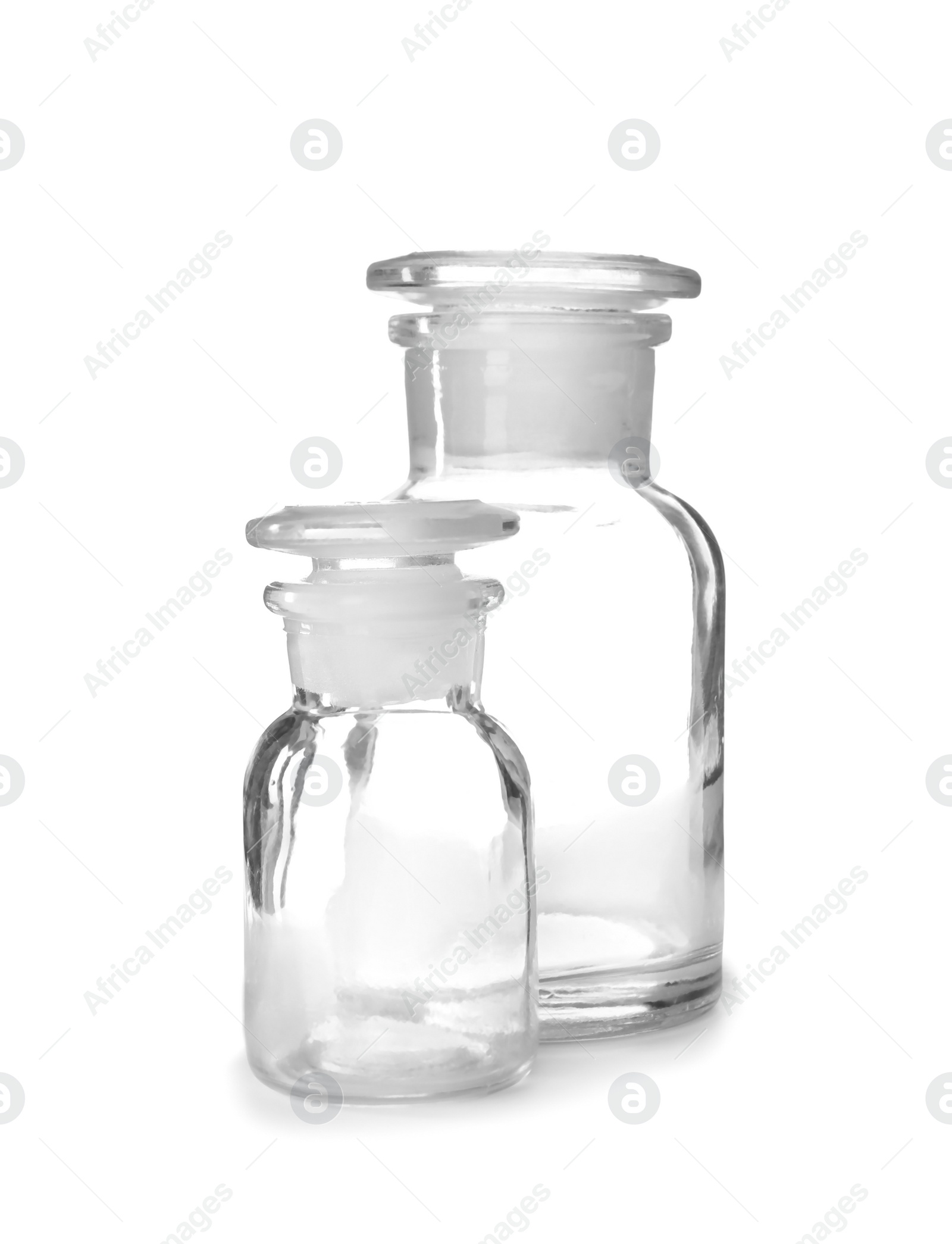 Photo of Empty bottles on white background. Laboratory analysis equipment