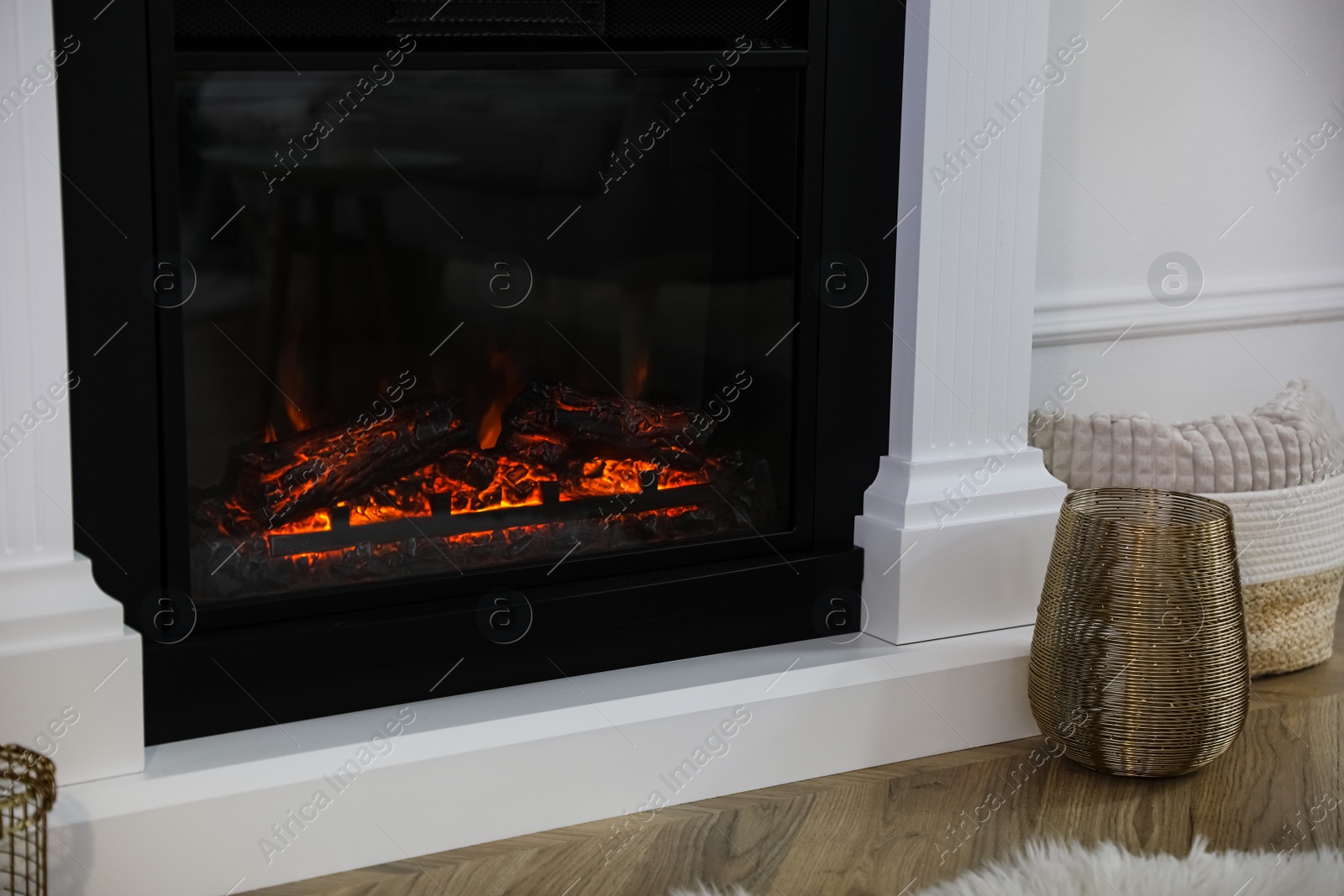 Photo of Modern fireplace in room, closeup. Interior design