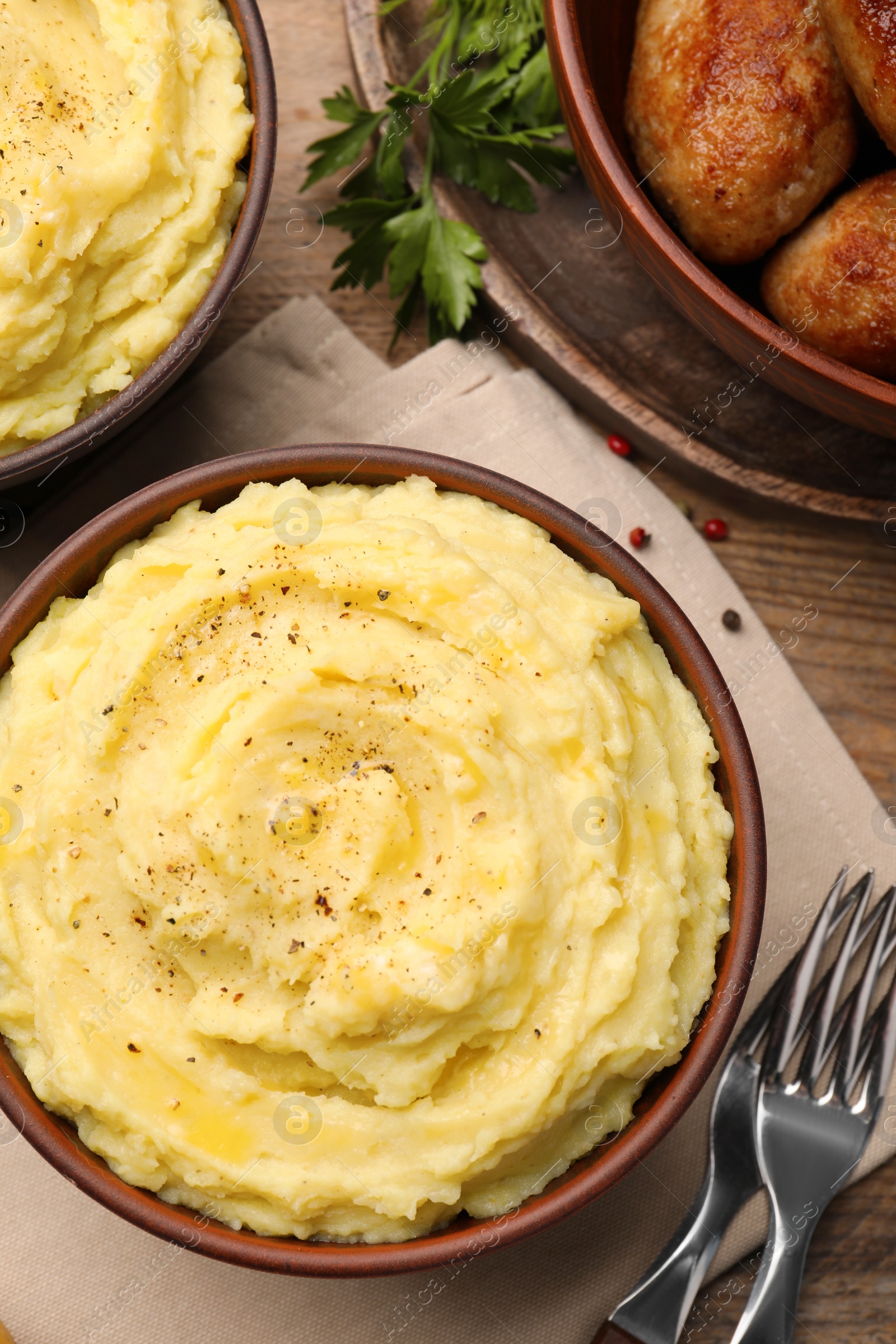 Photo of Flat lay composition with tasty mashed potatoes on wooden table