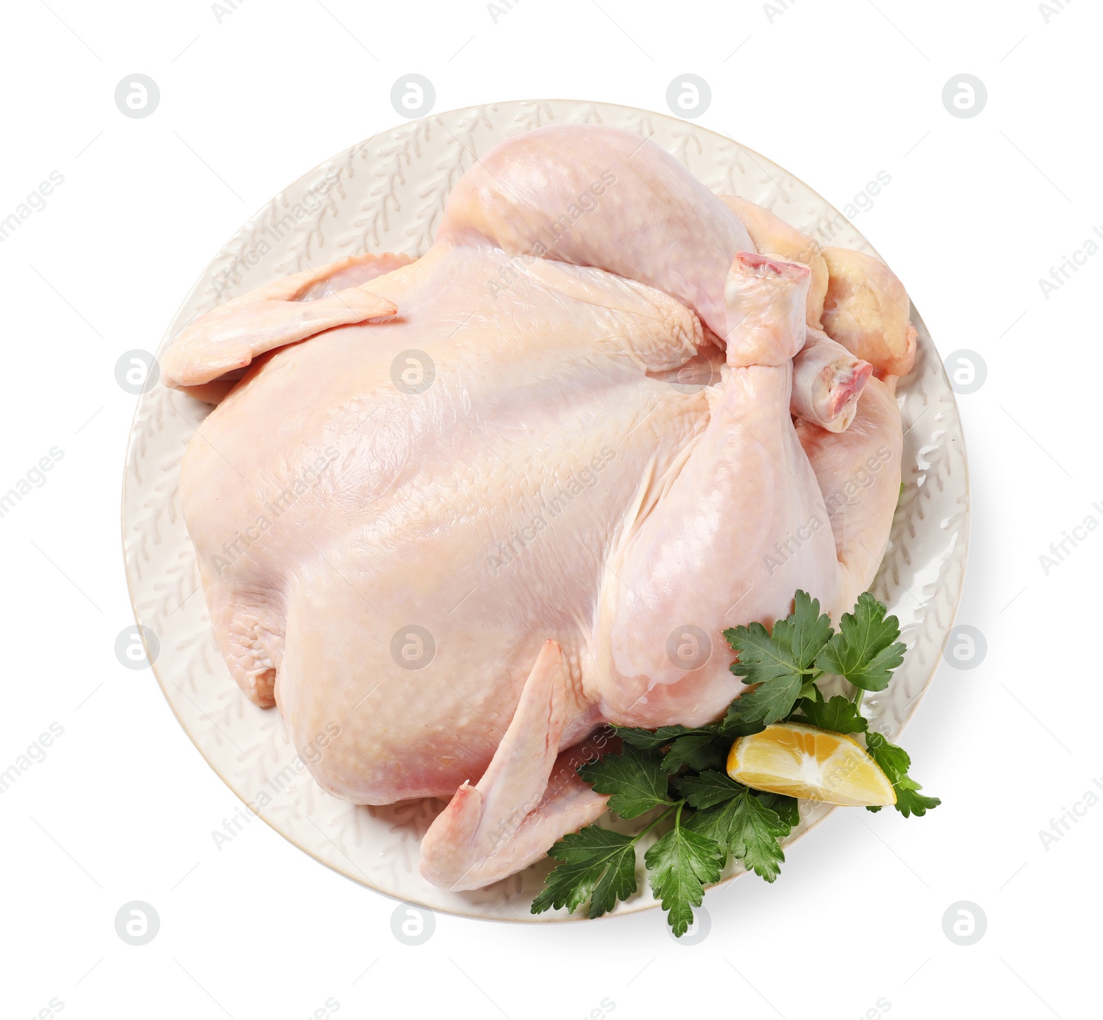 Photo of Fresh raw chicken with lemon and parsley isolated on white, top view