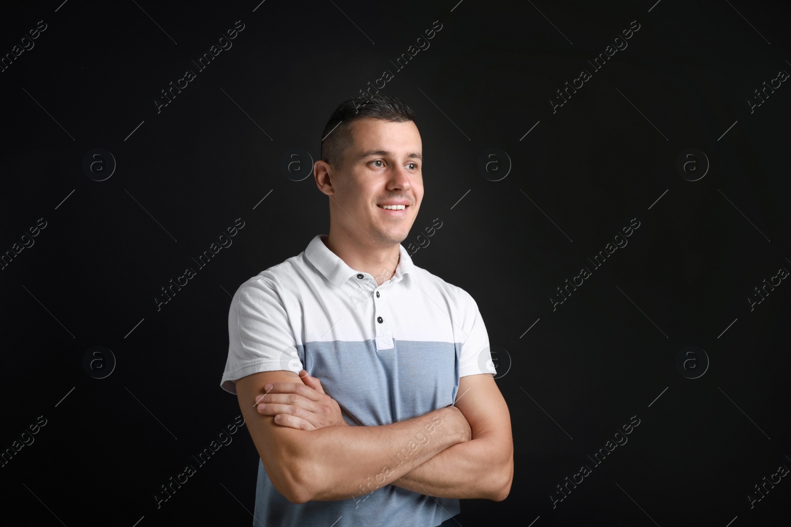 Photo of Portrait of handsome man on black background