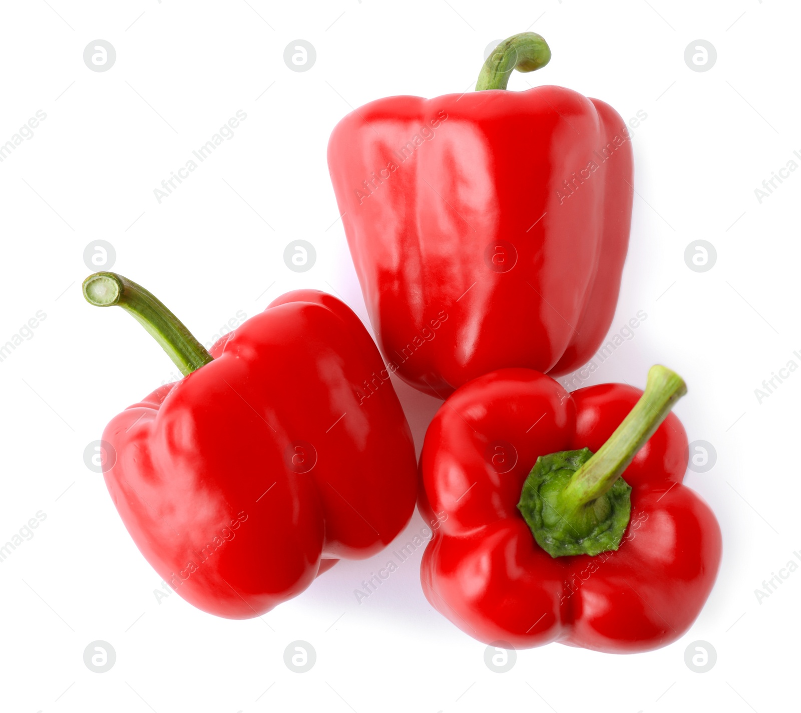 Photo of Ripe red bell peppers isolated on white, top view