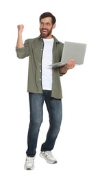 Photo of Happy handsome man with laptop on white background